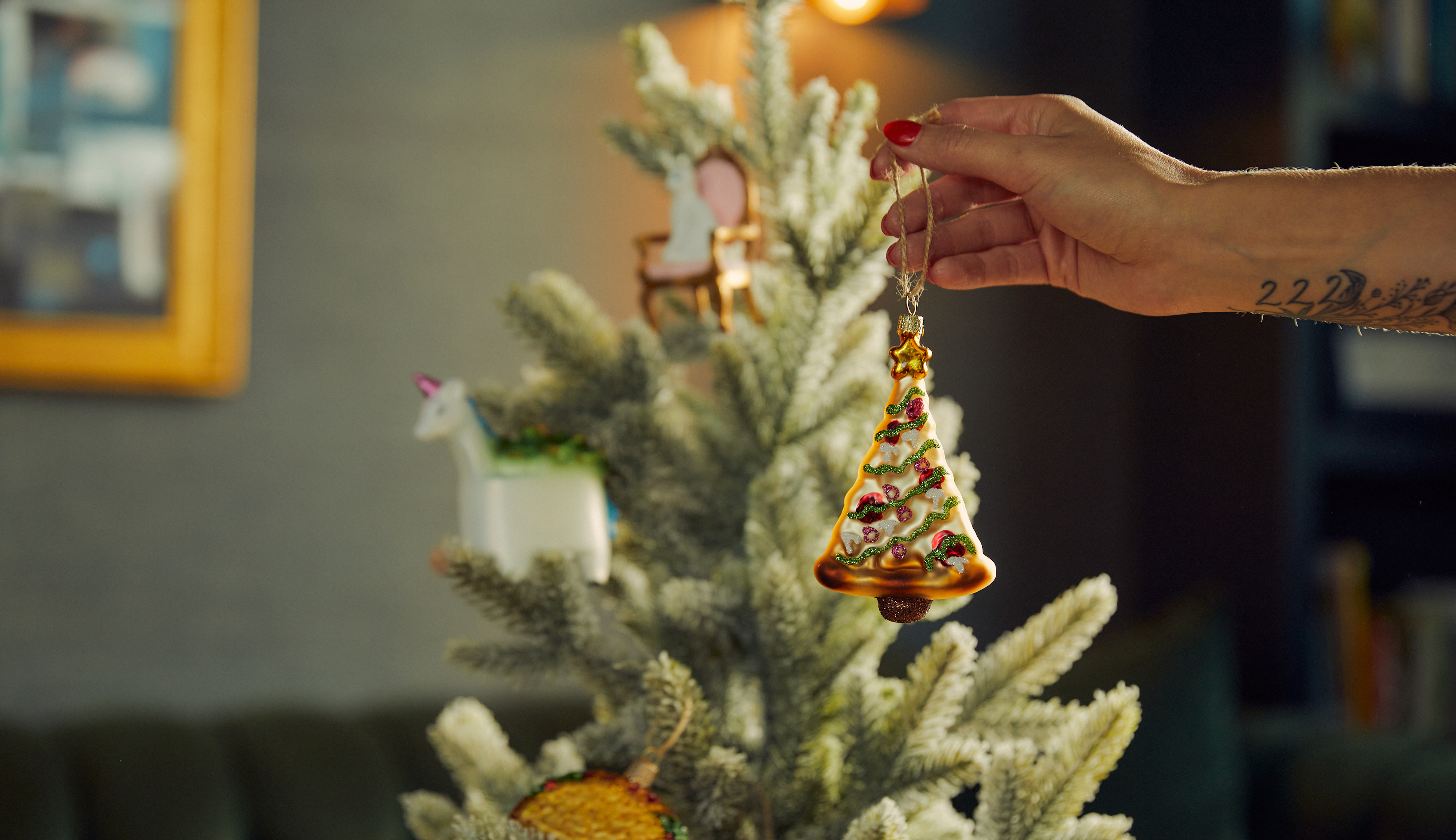 Tree decorated with celebratory holiday ornaments